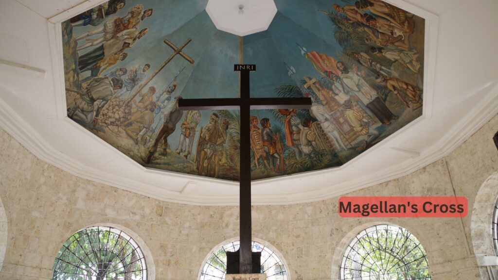 A wooden cross encased in tindalo wood, Magellan's Cross in Cebu City symbolizes the introduction of Christianity to the Philippines by Ferdinand Magellan in 1521, marking a pivotal historical moment.