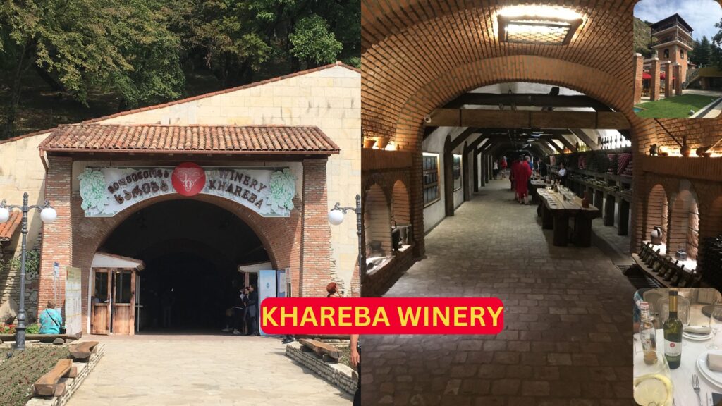 A bottle of Khareba Winery wine in front of Khareba Winery, showcasing Georgian winemaking.