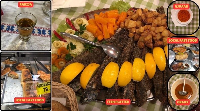 A selection of traditional Serbian foods including rakija, ajvar, and a river fish platter, beautifully arranged on a table.